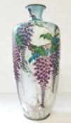 A large Cloisonné vase decorated with irridescant Wysteria on a silver ground. (AF)