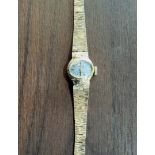 A 9ct gold Rotary lady's watch, Swiss 21 jewel movement, silver dial, black baton markers, 'bark'