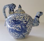 Oriental Ceramics - a Qing underglaze blue and white teapot decorated with dragon, six character