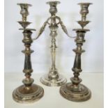A 19th century Shefflied silverplated two branch candelabra; a pair of silverplate on copper