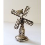 A Dutch silver miniature of tower windmill, on a circular base raised on four bun feet, J. Verhoogt,