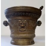 A substantial 17th century style continental bronze pestle & mortar, the mortar of flared circular