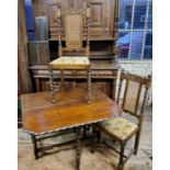 An early 20th century oak barley twist gate leg table with pie crust shaped edge; a pair of