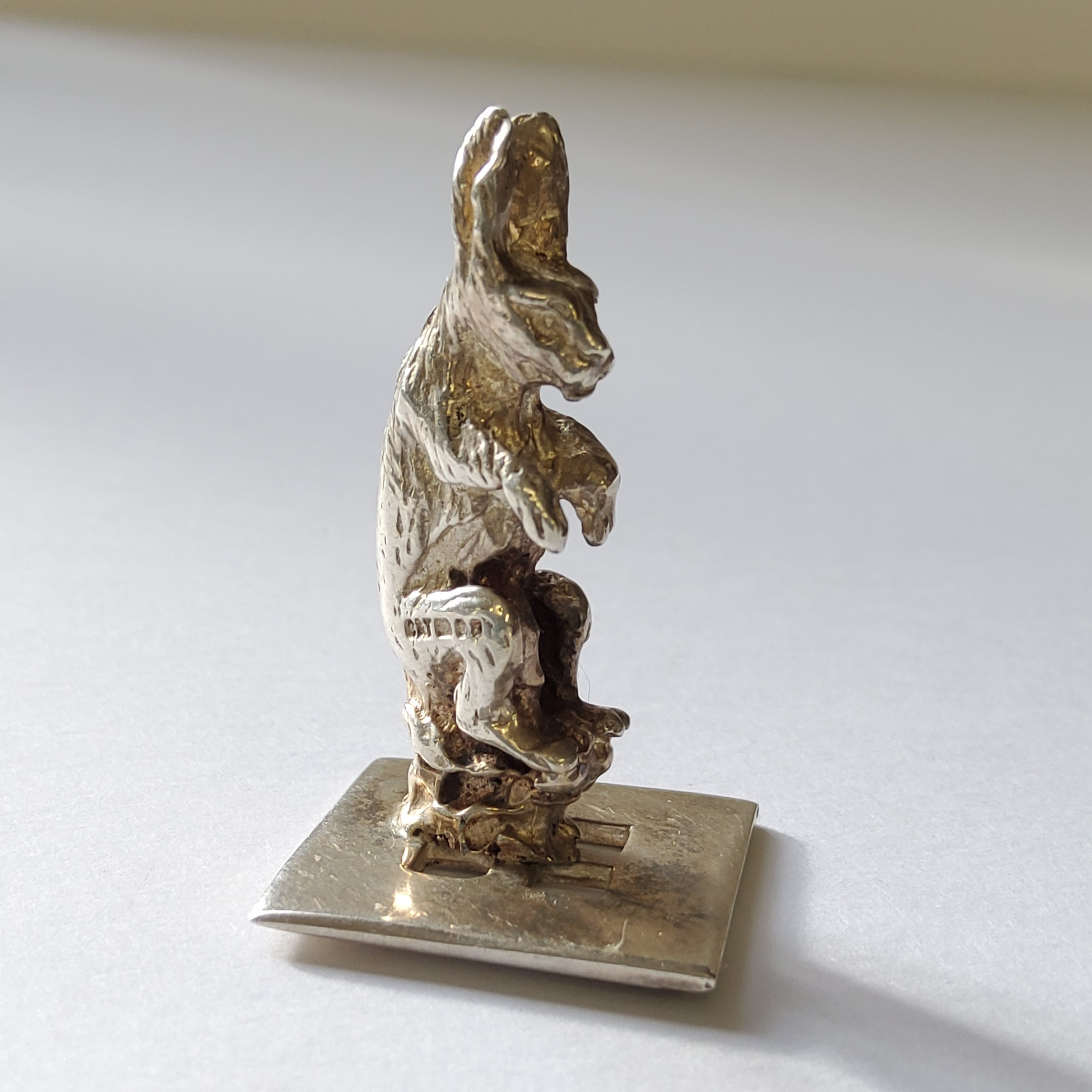 A Continental silver miniature of anthropomorphic seated rabbit, London import hallmark C&T, London,