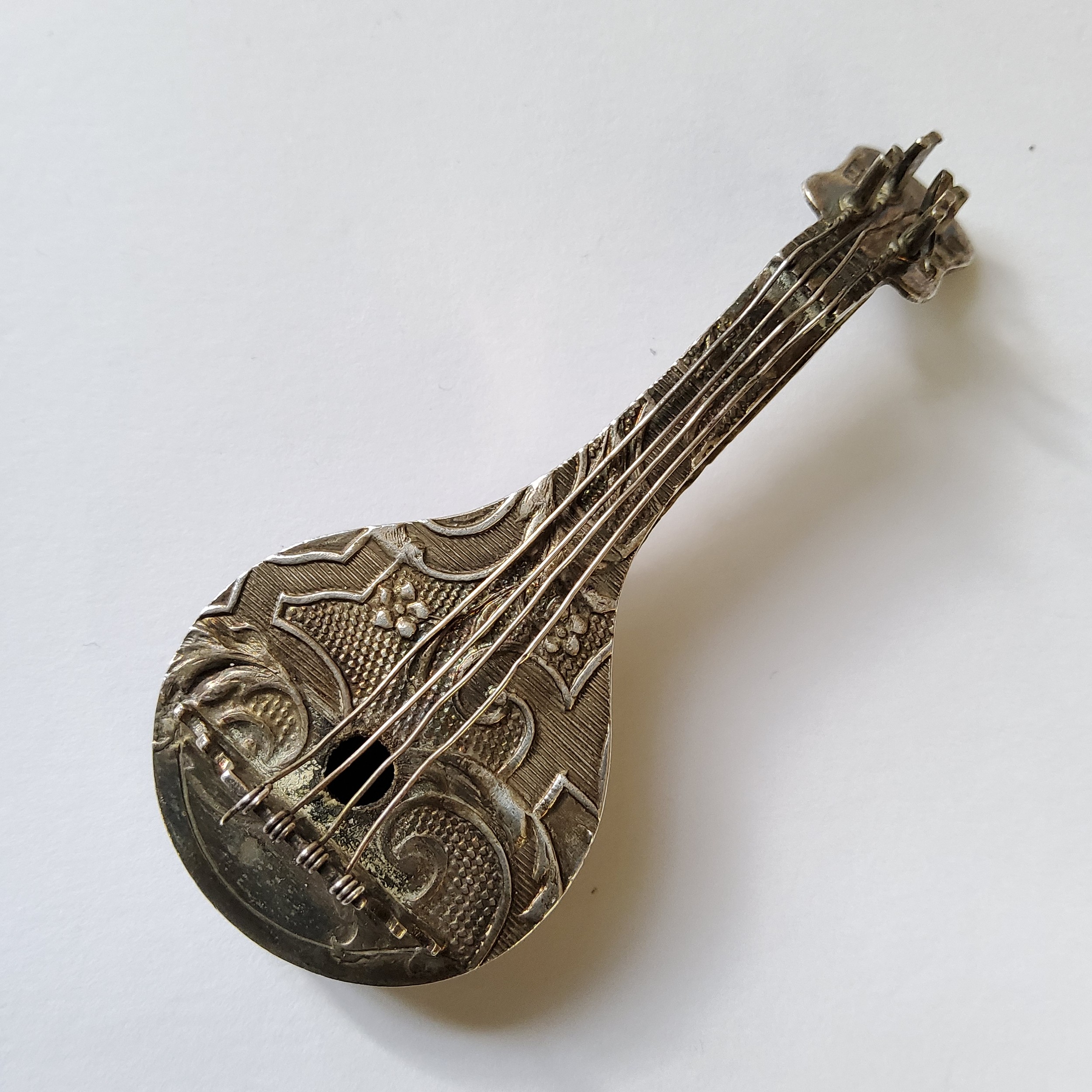 A Dutch 934 silver miniature of a Cittern, embossed in relief decoration with scrolls & foliage to - Image 2 of 4