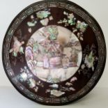 A 19th century Chinese cylindrical box, profusely inlaid with mother of pearl objects of desire,