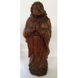 A substantial 18th century Italian carved wood Saint Santos / monk figure, he stands dressed in