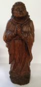 A substantial 18th century Italian carved wood Saint Santos / monk figure, he stands dressed in
