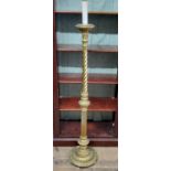 A gilt wood standard lamp, the fluted and twisted column terminating with a Corinthian cap, faux