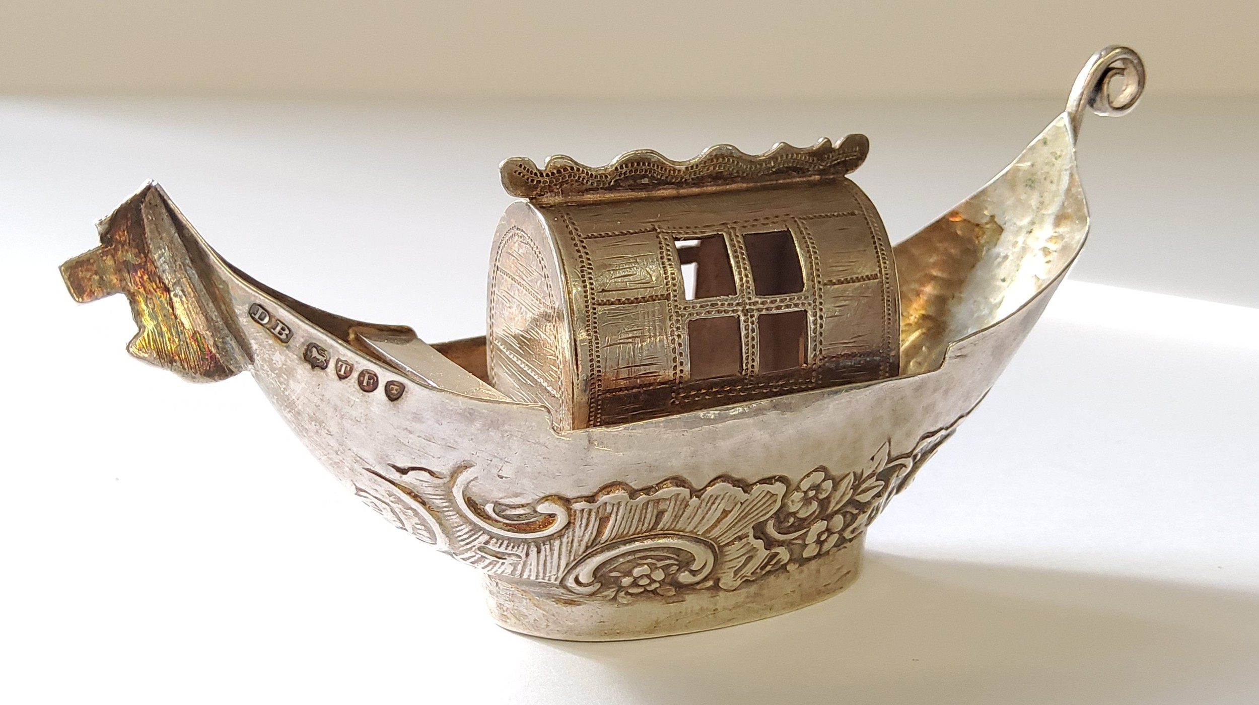 A Continental silver miniature of a house boat, stamped 930, import marks, David Bridge. London,