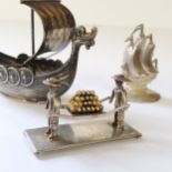 A Dutch silver miniature of two sailors carrying cannon balls, JvDH, sword mark, 13.66g; Norwegian