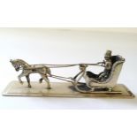 A Dutch silver miniature of a horse drawn sleigh & driver, stamped XXX & sword mark 23.1g