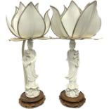 A pair of unusual Chinese blanc de chine table lamps in the form of Guanyin, lotus flower shades,