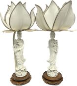 A pair of unusual Chinese blanc de chine table lamps in the form of Guanyin, lotus flower shades,