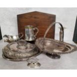 A silverplated swing handled pedesstal fruit basket, the rim decorated in relief with scrolls &