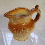 A Derbyshire possibly Brampton saltglazed cream jug decorated in relief with sprigs