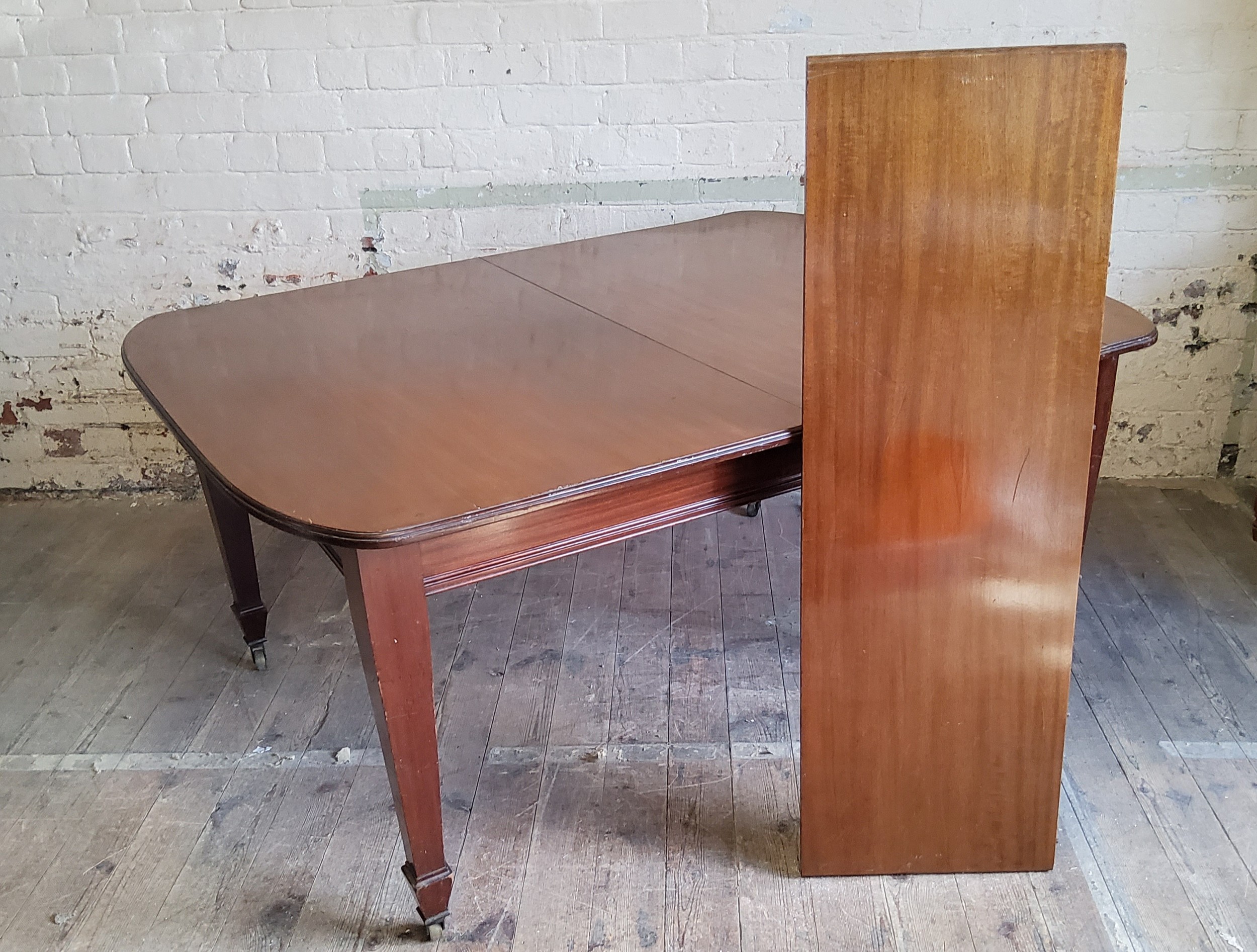 A Victorian mahogany wind-out table on brass castors c.1880, one additional leaf - Image 2 of 2