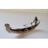 A Italian silver miniature of a gondola & gondolier, stamped 54VI 800, 18.62g