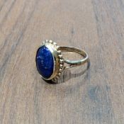 A 9ct gold ring set with an oval Lapis Lazuli stone, size N1/2, 3.1g gross