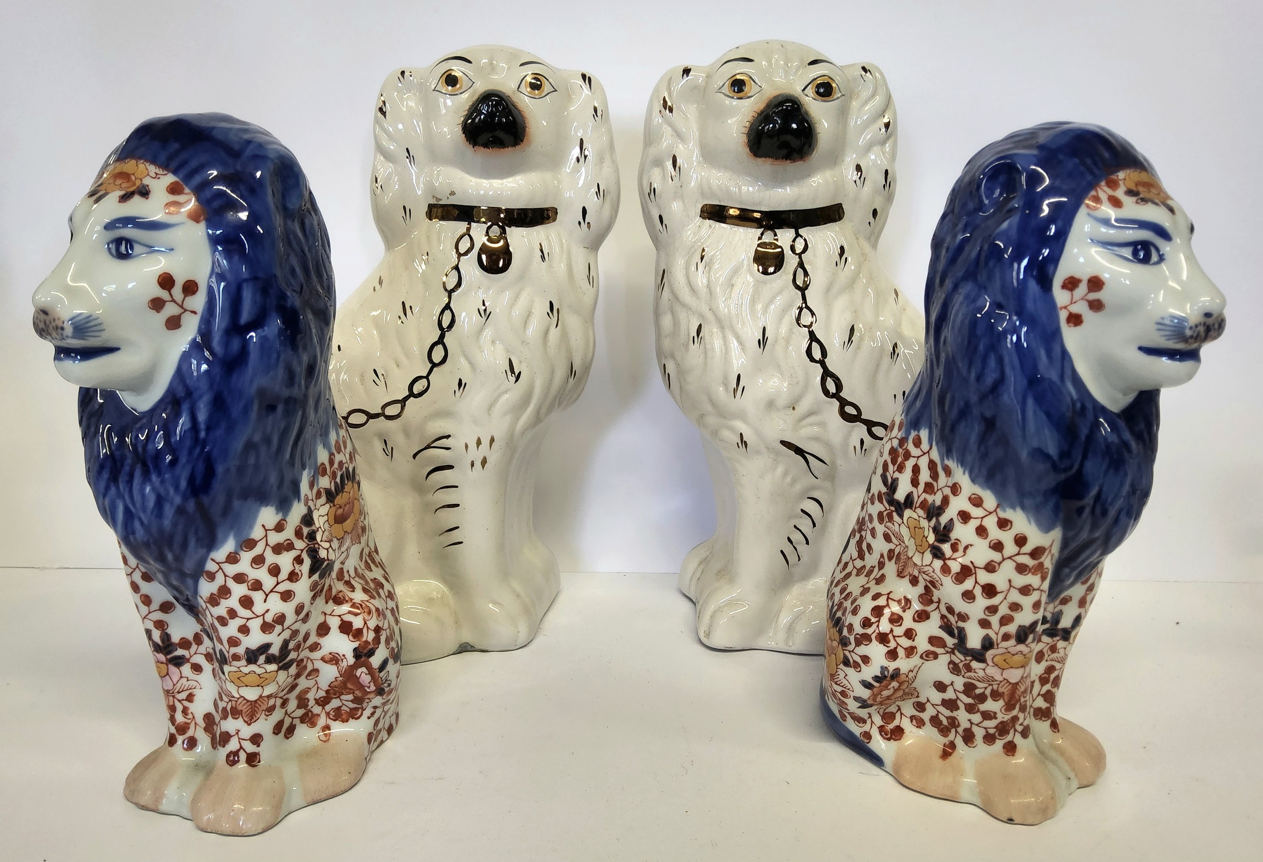 A pair of early 20th century Imari pattern temple / mantel lions; a pair of large Victorian