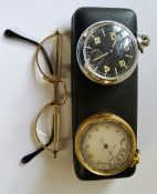 A gilt metal pocket barometer c.1920s; a Ingersoll stainless steel military style pocket watch,