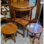 A very clean quarter veneered Empire style occasional table; a conforming Empire taste nest of three