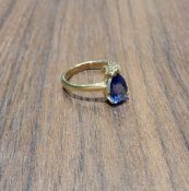 A contemporary 18ct gold ring, set with a pear shaped AAA Tanzanite, 10 x 6.5mm, approx 1.75ct & set