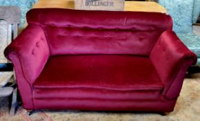 A Victorian country house drop arm two seater 'Knowle' sofa, deep button backed merlot coloured