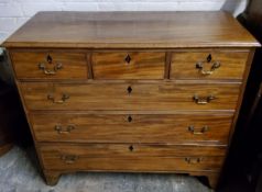 A George III mahogany chest of three short above three long cock beaded drawers,  ebony lozenge
