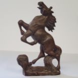 An early Chinese carved soapstone model of a rampant horse, 20cm high