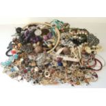 A large quantity of fashion rings, costume jewellery, beads, bangles, brooches, pendants etc qty