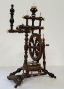 A German miniature turned beech and bone spinning wheel, late 19th c, peddle inscribed Strasbourg,