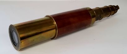 A three drawer brass and mahogany nautical telescope. Excellent condition.