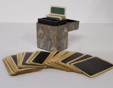 A Liberty of London playing card case containing two sets of playing cards