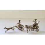 A Dutch silver miniature of a horse drawn carriage and driver, 1906-1953 sword mark, 18.49g; another