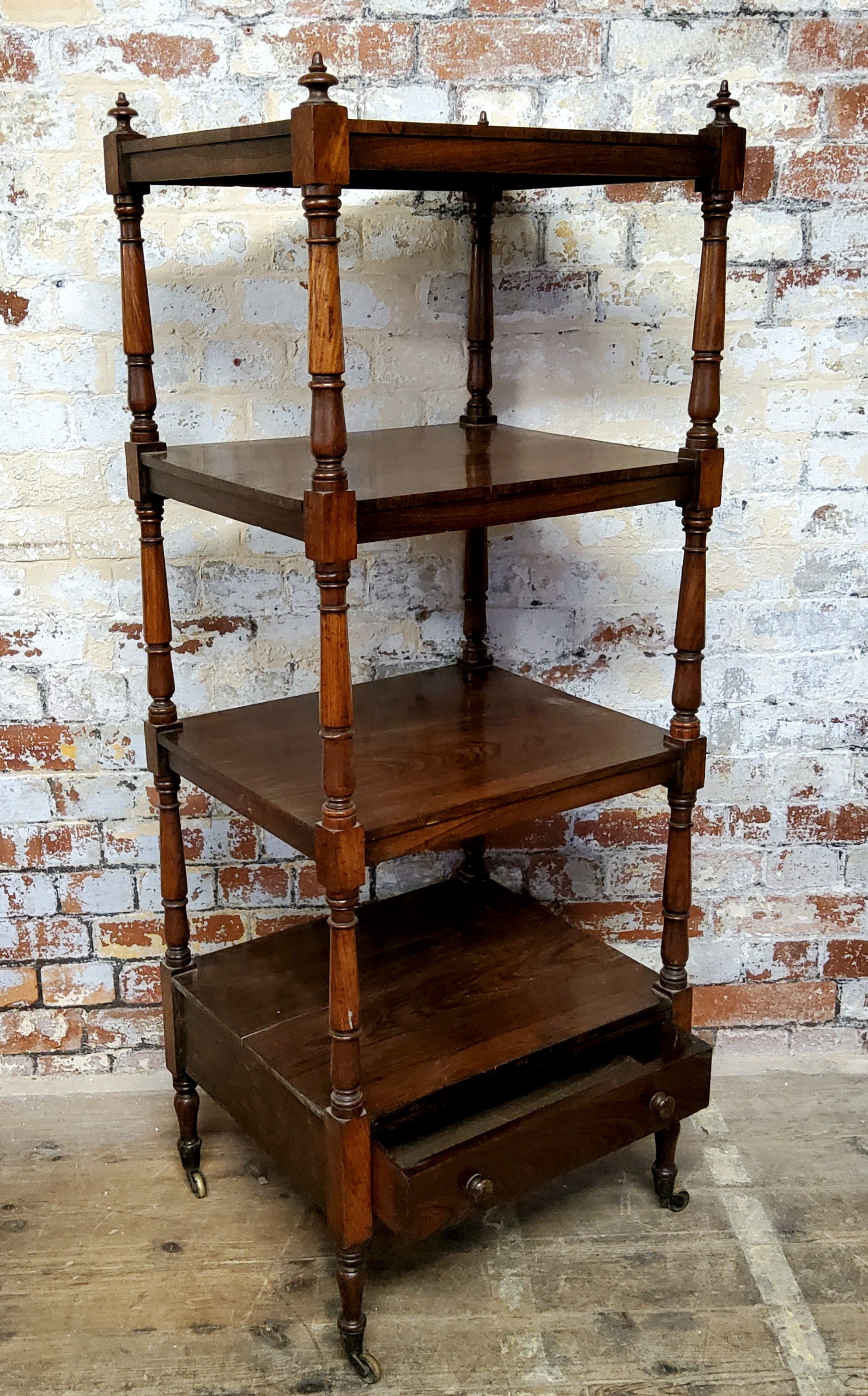 A good early 19th century rosewood four-tier whatnot, fitted with a single drawer to the base,