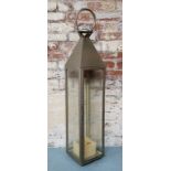 A large stainless steel / glass Moroccan style storm lantern 114cm heigh x 22.5cm wide x 22.5cm deep