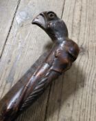 Oriental - an early Japanese walking cane carved with a bearded elder and golden eagle mask pommel