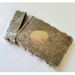An Edwardian silver card case, chased & engraved with swags & flowers, vacant cartouche, **Ltd,