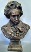 A substantial bronze effect bust of Beethoven, standing 63cm high.