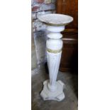 A carved and painted jardiniere stand, with a turned and wrythern twisted tapering support, plinth