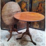 A George III Irish mahogany tilt top table with raised border on a fluted column terminating in