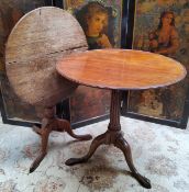A George III Irish mahogany tilt top table with raised border on a fluted column terminating in