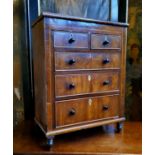 A 19th century  flamed mahogany and boxwood miniature/apprentice chest, of two short above three