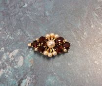 An Art Deco style 9ct rose gold clasp for a three string pearl necklace, set with garnets & pearls