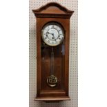 A Fox & Simpson golden oak finish wall clock, 8 day movement, 4/4 chime, automatic night shut off,