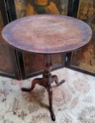 A George III oak and elm tilt top tripod tavern table c.1780