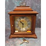 A 20thC mahogany cased bracket clock, the brass dial bearing Roman numerals, silvered chapter