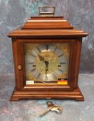 A 20thC mahogany cased bracket clock, the brass dial bearing Roman numerals, silvered chapter