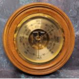 A German large circular walnut aneroid barometer 25.5cms dia. NOS in original packaging